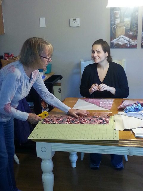 Lindsey pinning away and Mom slaving away at the cutting mat