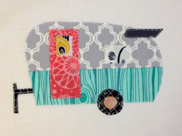 Detail shot of one of the trailer appliques I put on the backing.