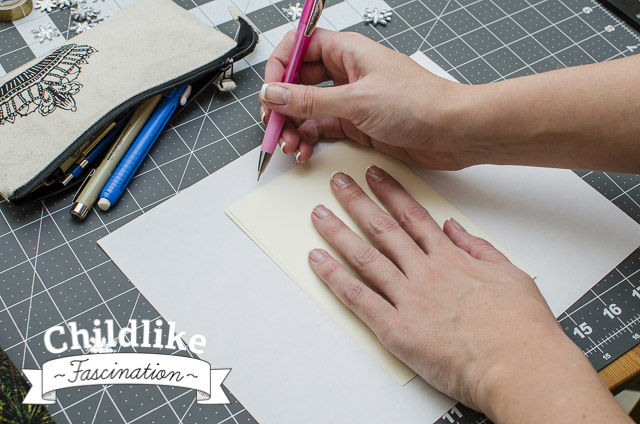 Trace size of card on a piece of paper