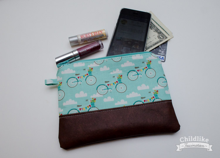 Little clutch holds cell phone, lip gloss and money no problem!