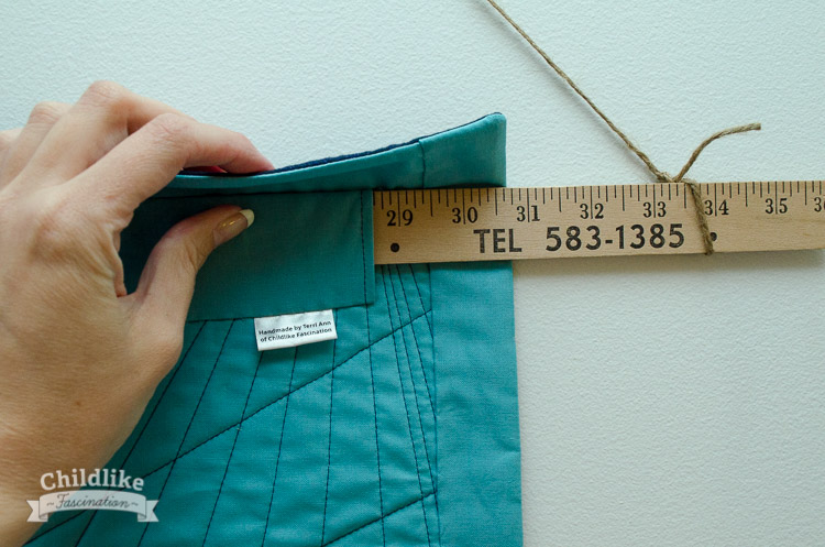 A faced binding doesn't show on the front and let's the quilting extend to the edge - perfect for a wall hanging