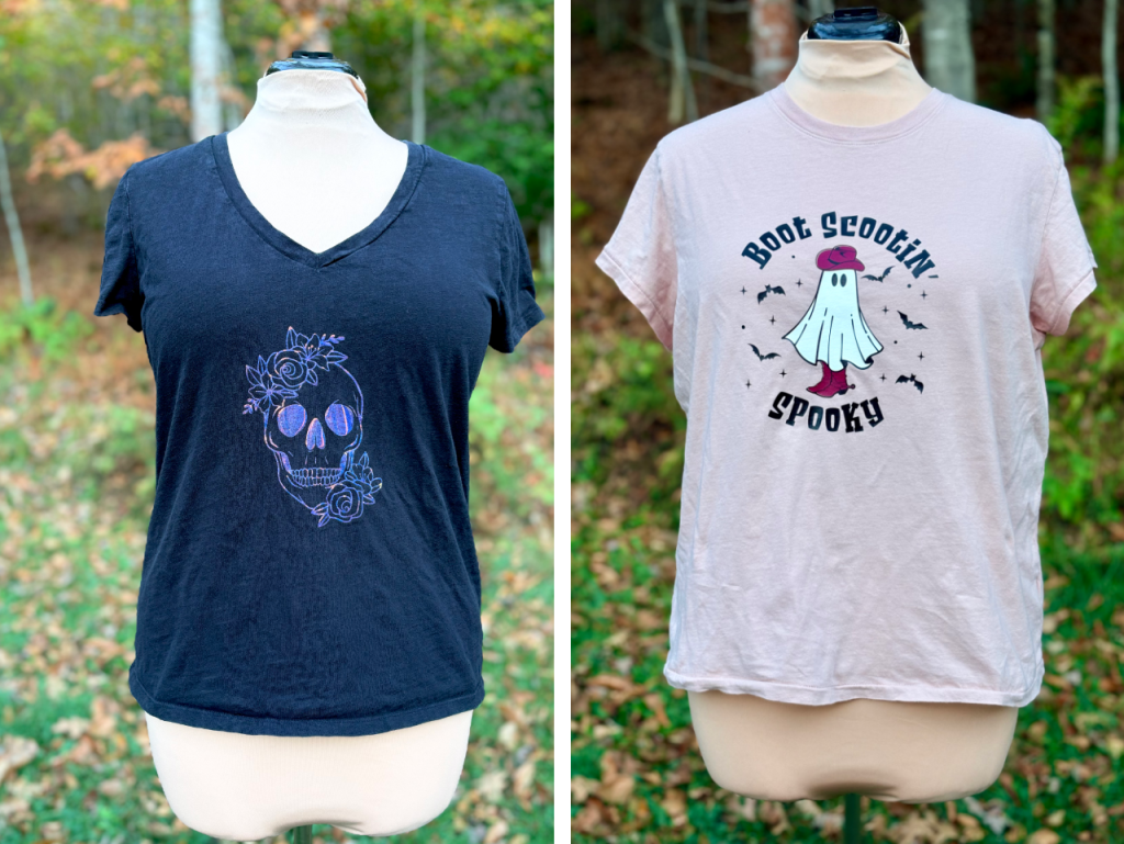 Two t-shirts on mannequins. The shirt on the left is black with a holographic skull and flower design. The shirt on the right is pink with a ghost wearing a cowboy hat and boots, and the text “Boot Scootin’ Spooky.”
