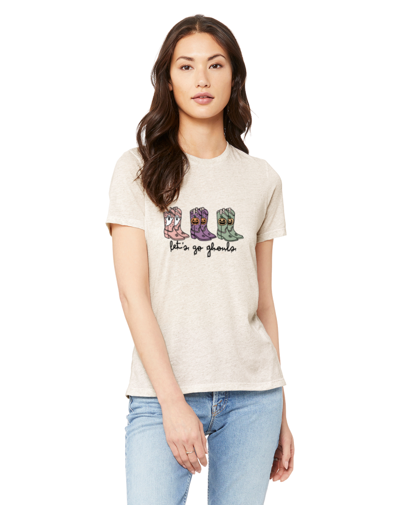 Picture of a brunette woman wearing an oatmeal t-shirt with the let's go gouls design on it